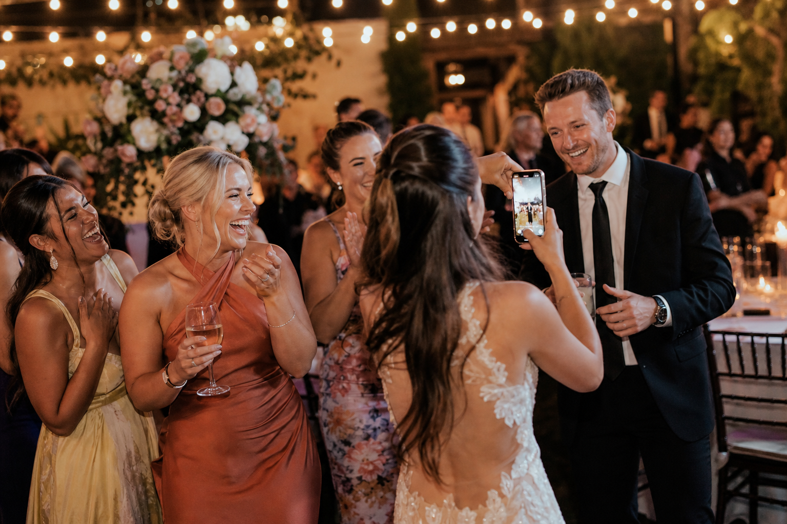 Wedding guests celebrating near the dance floor